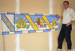 This was one of 55 different banners that had to be painted (on both sides!).