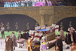 This is the end result. The backdrop was 40m wide. In the foreground is an ice rink, on which the boats and skaters performed the final scene. The flags on the boats were also painted by me. Queen Elizabeth II was present for this performance.