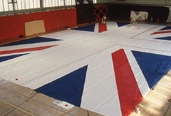 This was made from very light cloth as it had to be opened and later removed very quickly by about 20 people. It measured about 30m x 20m.